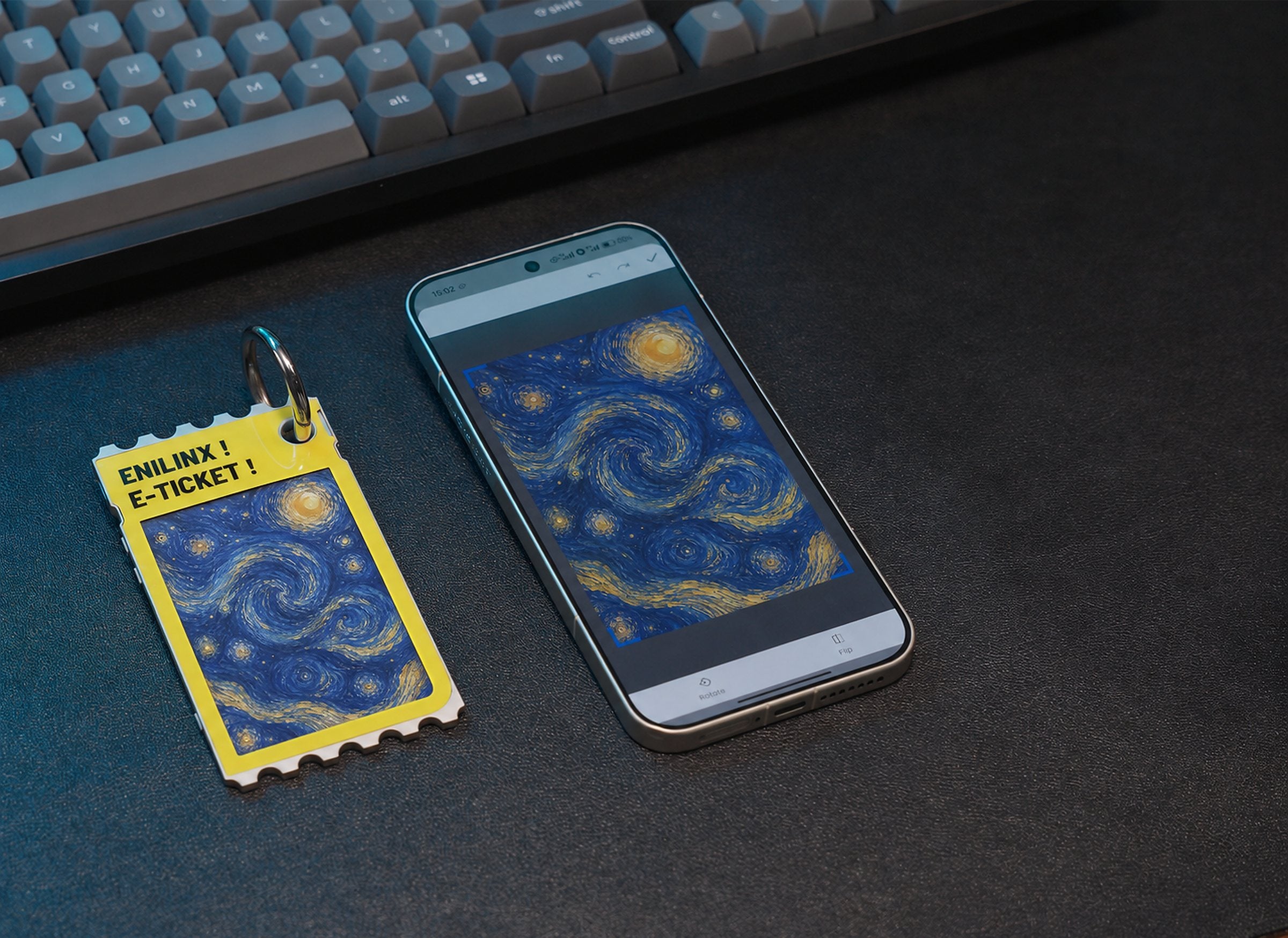 スマホの画像をそのままTICKEYに転送した例。ゴッホ「星月夜」を表示した状態で、キーリング付きの筐体と裏面のギザギザ(切符を模した意匠)が確認できる